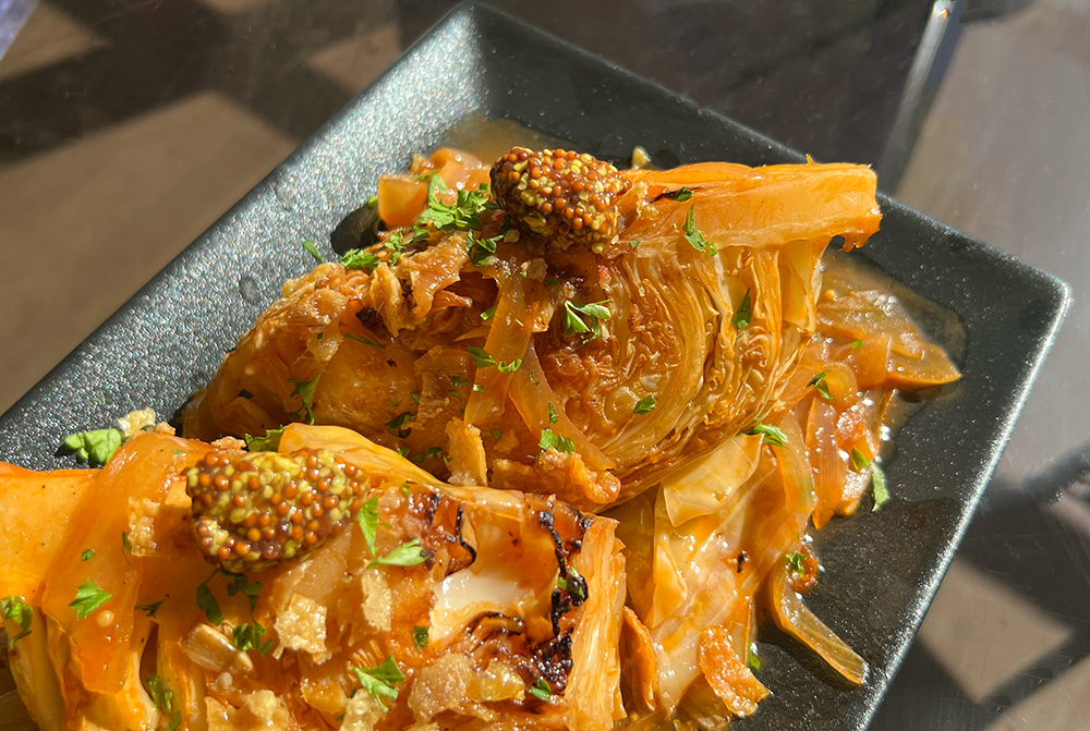 Charred Cabbage with Crispy Chicken Skin.