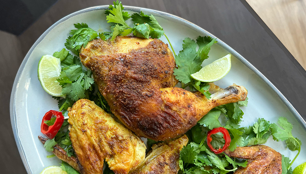 Curry Roasted Chicken served on a platter.